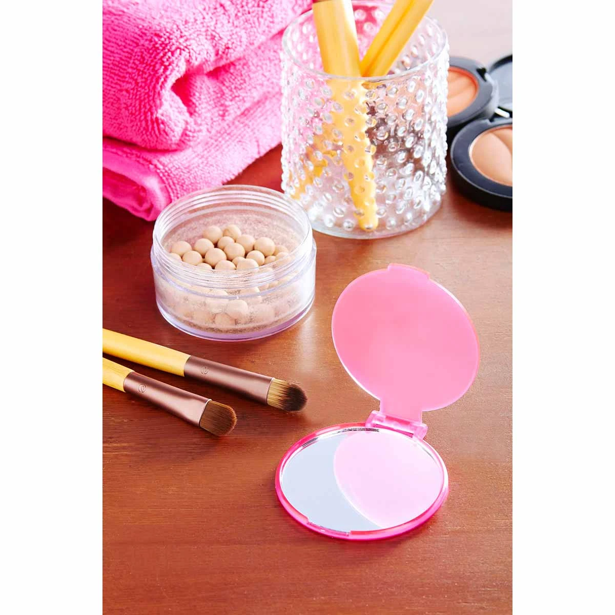5. Espejo de bolsillo compacto para marcas de belleza.